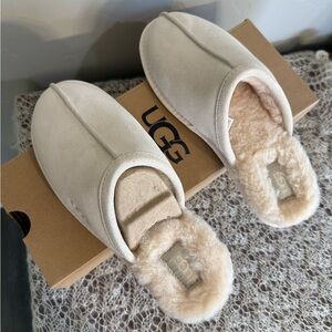 UGG Woman’s Tan Slippers. New in Box. Size 9